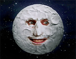 A face covered in cream to look like a moon. Taken from the Mighty Boosh